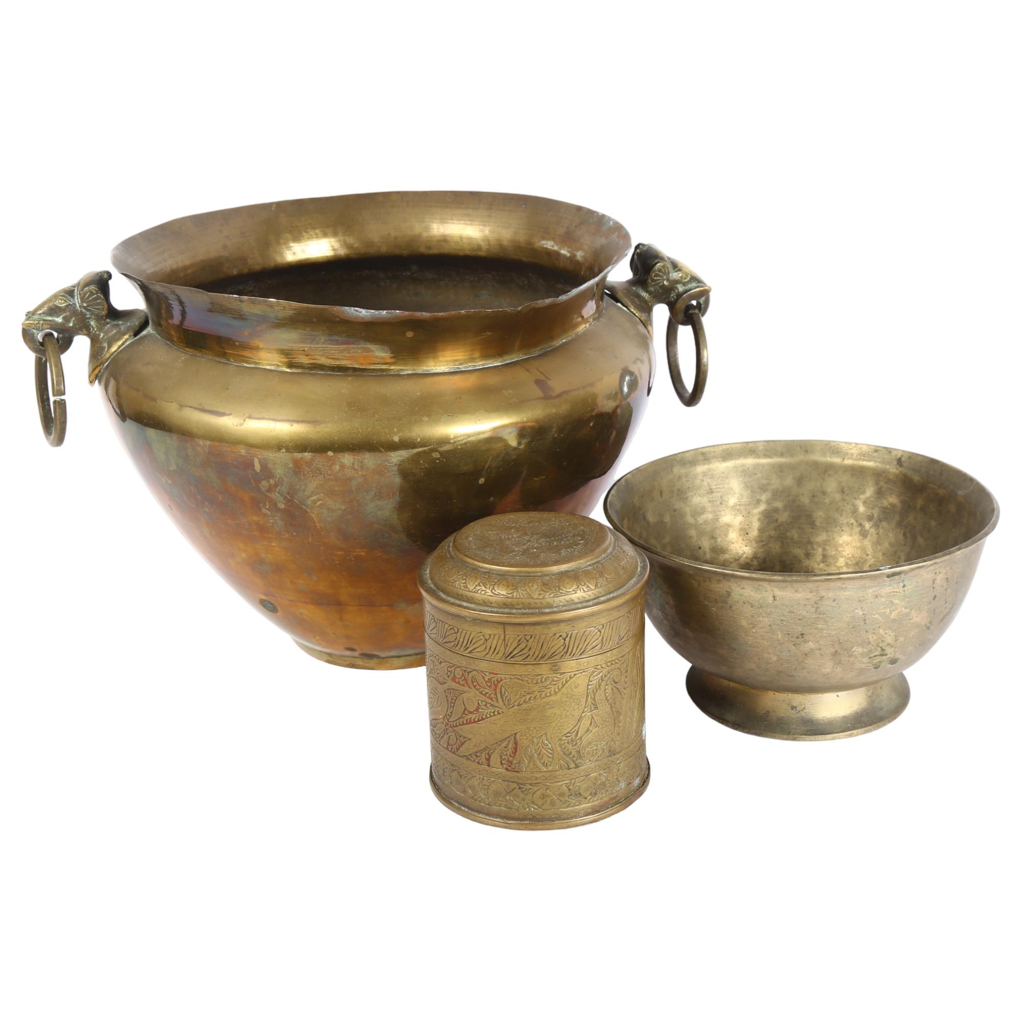 An Indian brass jardiniere with elephant ring handles, height 21cm, a footed bowl, and engraved