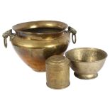 An Indian brass jardiniere with elephant ring handles, height 21cm, a footed bowl, and engraved