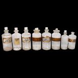 A group of 8 Antique Chemist's bottles with 7 stoppers, 1 with etched Acid.Nitric.D label, the