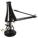 HERBERT TERRY - a mid-century black anglepoise lamp on circular base, stamped to the bottom of the