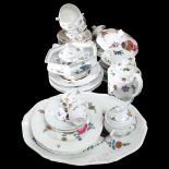 Limoges porcelain tableware, with floral decoration, including a coffee pot, serving plate etc