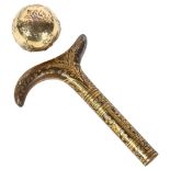 A Toledo gold Damascene steel parasol handle, and a French silver-gilt globular walking cane knop,