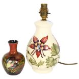 A Moorcroft cream ground tube-lined table lamp, and a smaller Moorcroft vase, 12cm