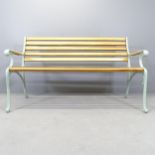 A pine slatted garden bench with cast iron ends. 144x84x66cm