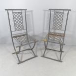 A pair of grey painted iron garden seats.