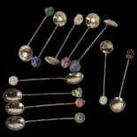 A cased set of 6 unmarked silver coffee spoons, with stone set handles, a cased set of spoons with