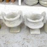 A pair of two-section concrete garden urns. 50x51cm