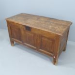 An antique stained pine coffer. 113x83x50cm very heavy worm damage. Repairs need to hinges.