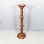 A modern mahogany torchere stand. Height 98cm.
