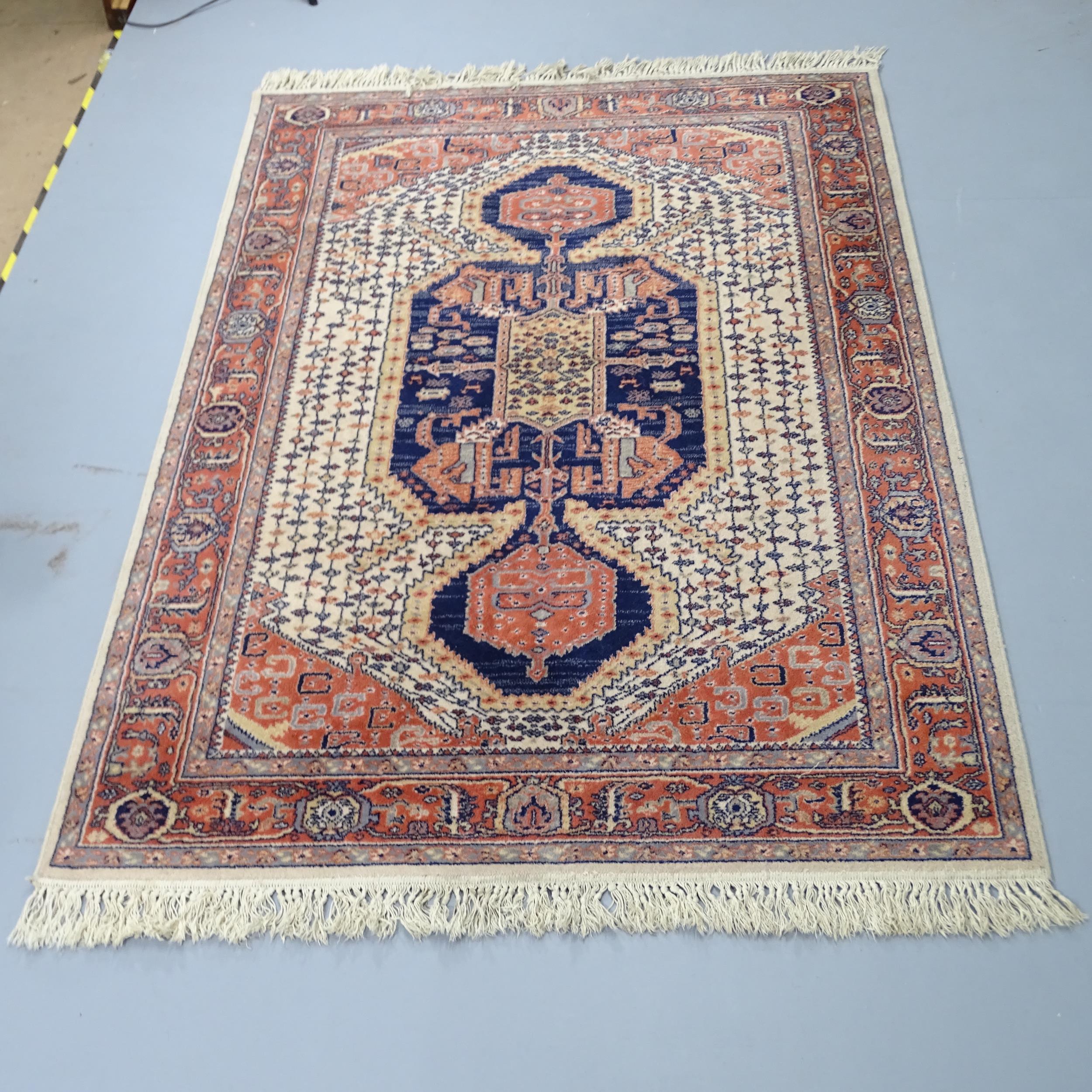 A cream-ground Keshan carpet. 200x140cm.