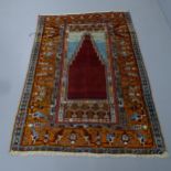 An early Turkish prayer rug, circa 1930/40s. 172x116cm Discoloured to centre.