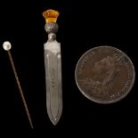 An unmarked gold stickpin, surmounted by a pearl, a silver thistle design bookmark, and a