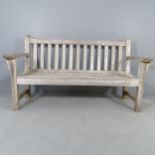 A weathered teak slatted garden bench, with label for Barlow Tyrie. 161x90x65cm.