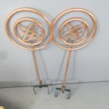 A pair of revolving copper garden sprinklers. Height overall 106cm.