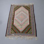A Persian rug. 166x97cm.