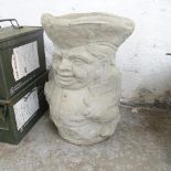 A concrete planter/umbrella stand in the form of a toby jug. 30x43cm