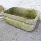 A weathered stone sink. 73x29x53cm.