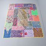 A patchwork wall hanging, 194x144cm, and an Embroidered wool shawl/wall hanging, 223x105cm. (2).