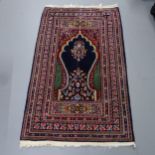 A blue-ground Persian design-prayer rug. 133x78cm.