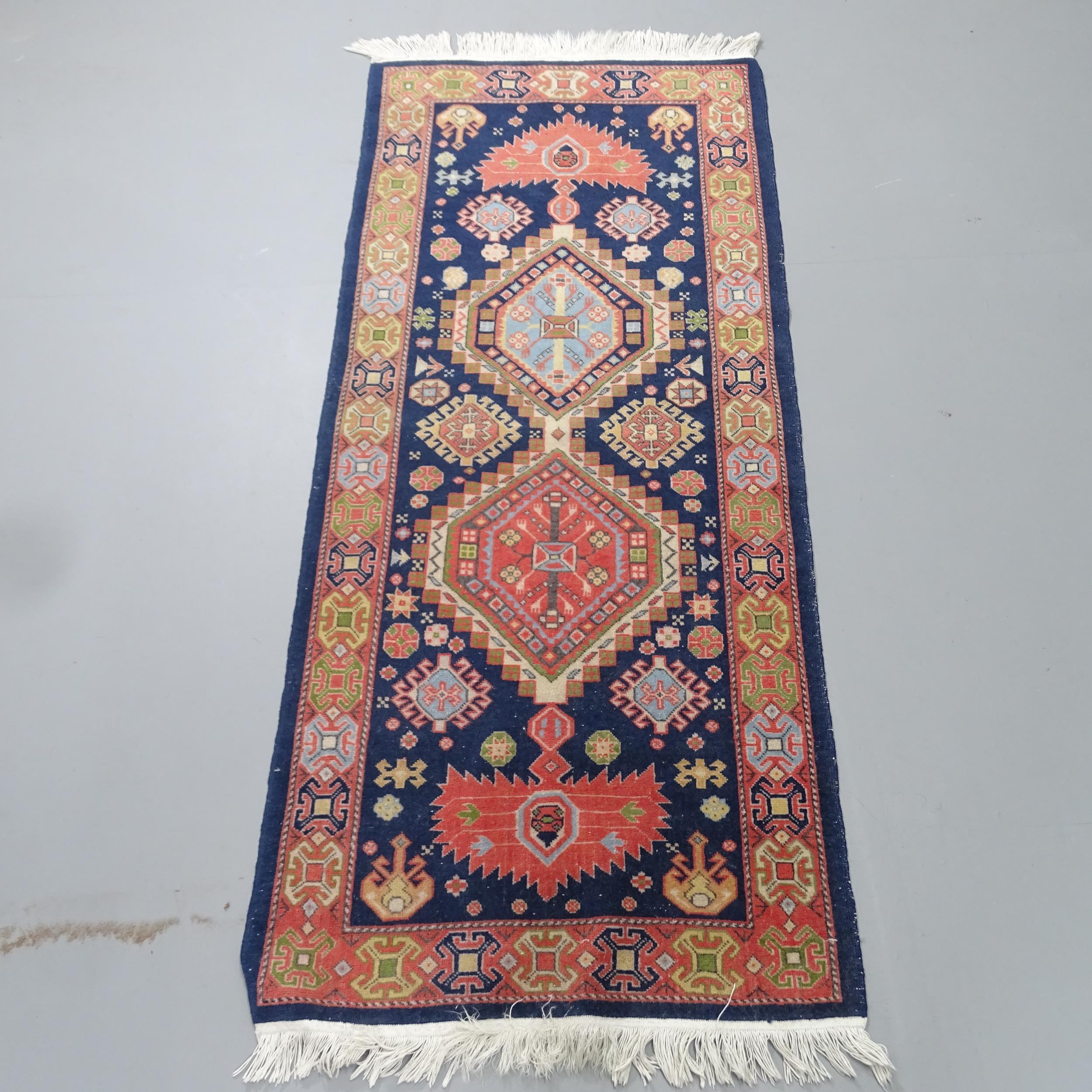 A hand-knotted Caucasian runner. 147x63cm