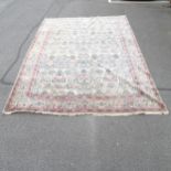 A large cream ground Persian style carpet. 439 x 315cm
