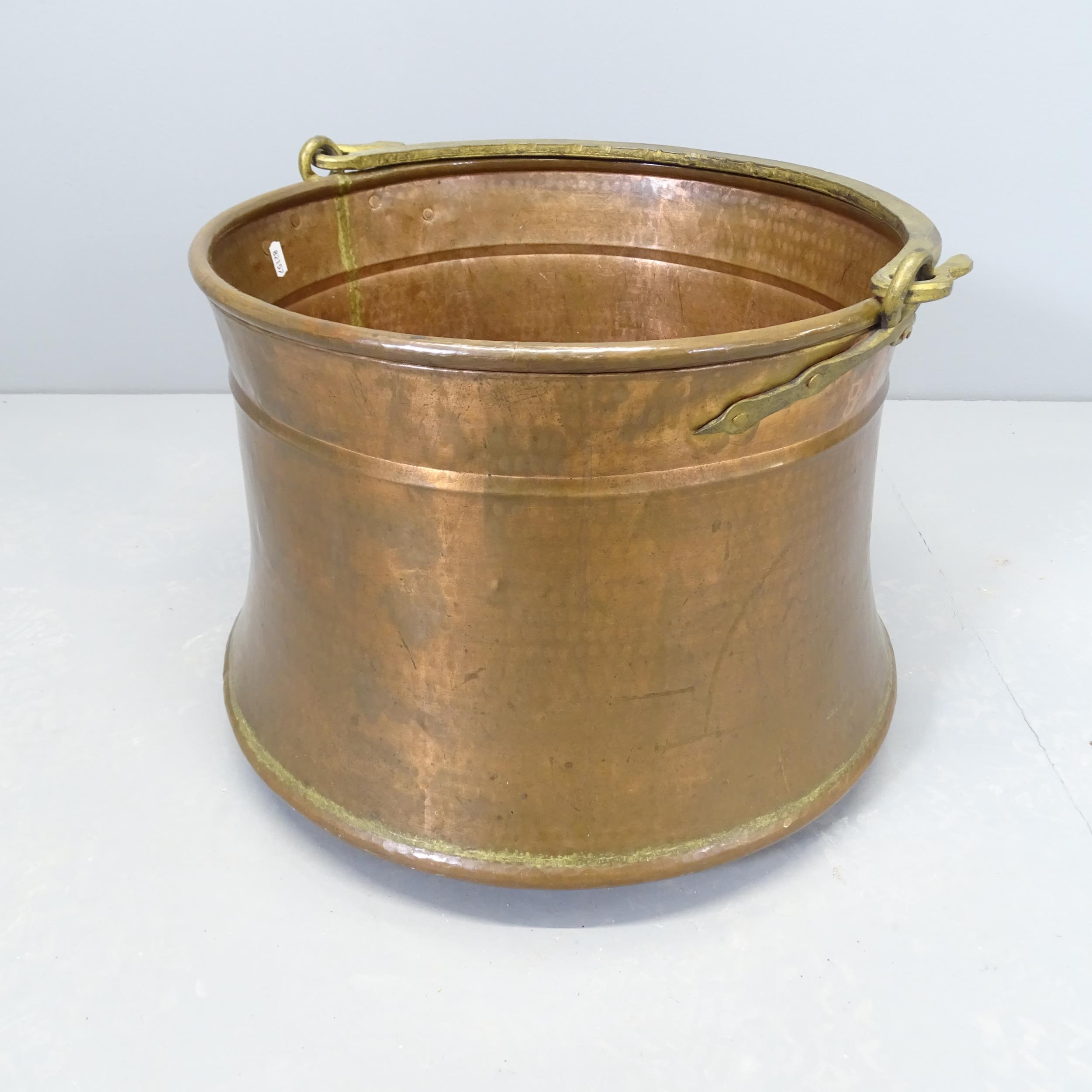 A large George III copper log bucket / cauldron. Overall diameter 55cm, top 45cm. Height 37cm.