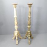 A Pair of carved wooden torcher stands 108cm.