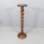 A mahogany jardiniere stand with spiral turned column. H - 99cm.