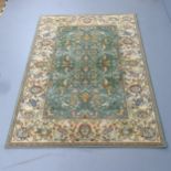 A cream-ground Serapi design carpet. 202x142cm.