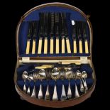 A Sheffield silver plate mixed canteen of cutlery the knives by Cooper Brothers, with mixed spoons