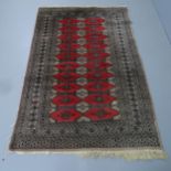A cream-ground silk Buchara rug. 194x126cm