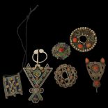 A collection of North African silver coral with blue enamel decorated mounts and pendants, a similar