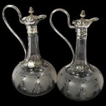 * Description amended* A pair of Edwardian cut-glass and silver plate-mounted decanters, with swan-