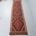 A Suzni Kilim runner. 310x78cm.