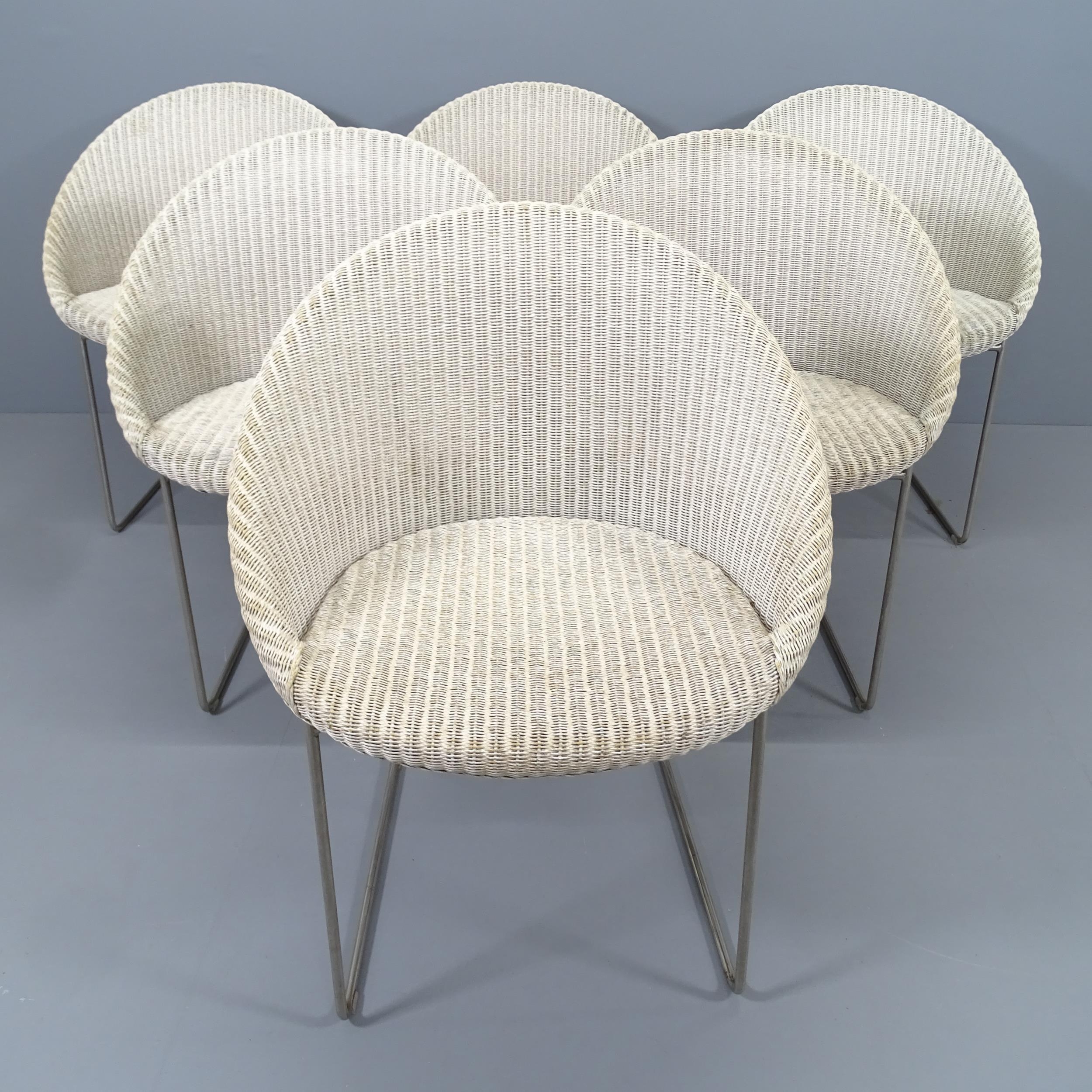 A set of six Vincent Shepperd Gipsy wicker dining chairs on stainless steel sled base. RRP £495