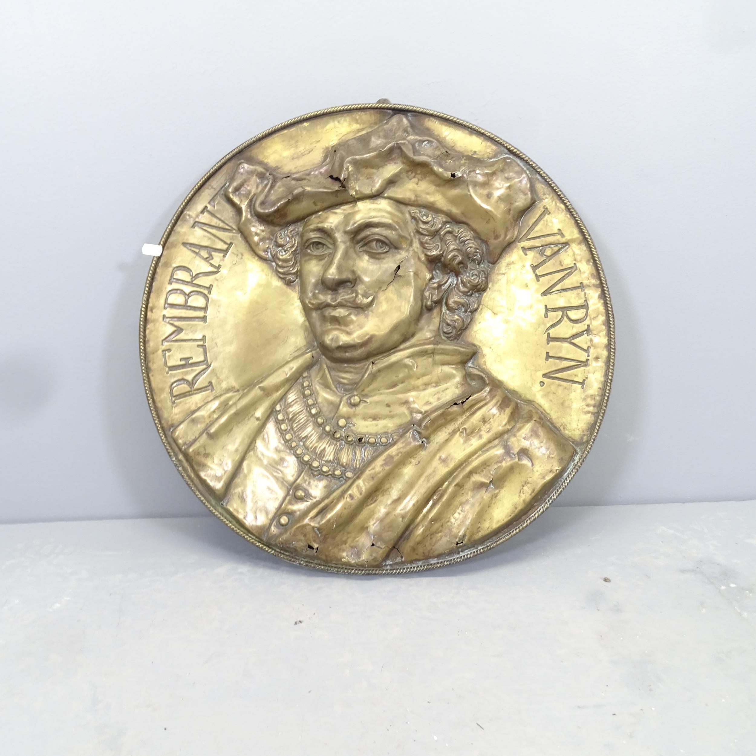 A brass wall plaque depicting Rembrant. Diameter 60cm