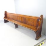 A Vintage stained pine church pew. 300x97x44cm