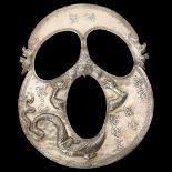 An ornate Chinese silver mask, with repousse dragon decoration and character marks, length 18.5cm