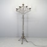 A wrought metal electric five light candelabra. Height 168cm.