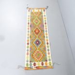 A Chobi Kilim runner. 210x64cm.