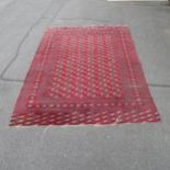 A large red ground Afghan carpet. 378 x 279cm.