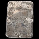 An ornate scrolled engraved silver plated card case, named to M Downie