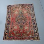 A red and blue-ground early 20th century Malayer rug, 152x106cm.