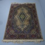 A cream-ground Kerman rug. 220x140cm