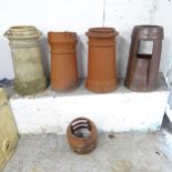 A group of 4 chimney pots. Largest - 35x62cm. All show some degree of damage, one has top broken off
