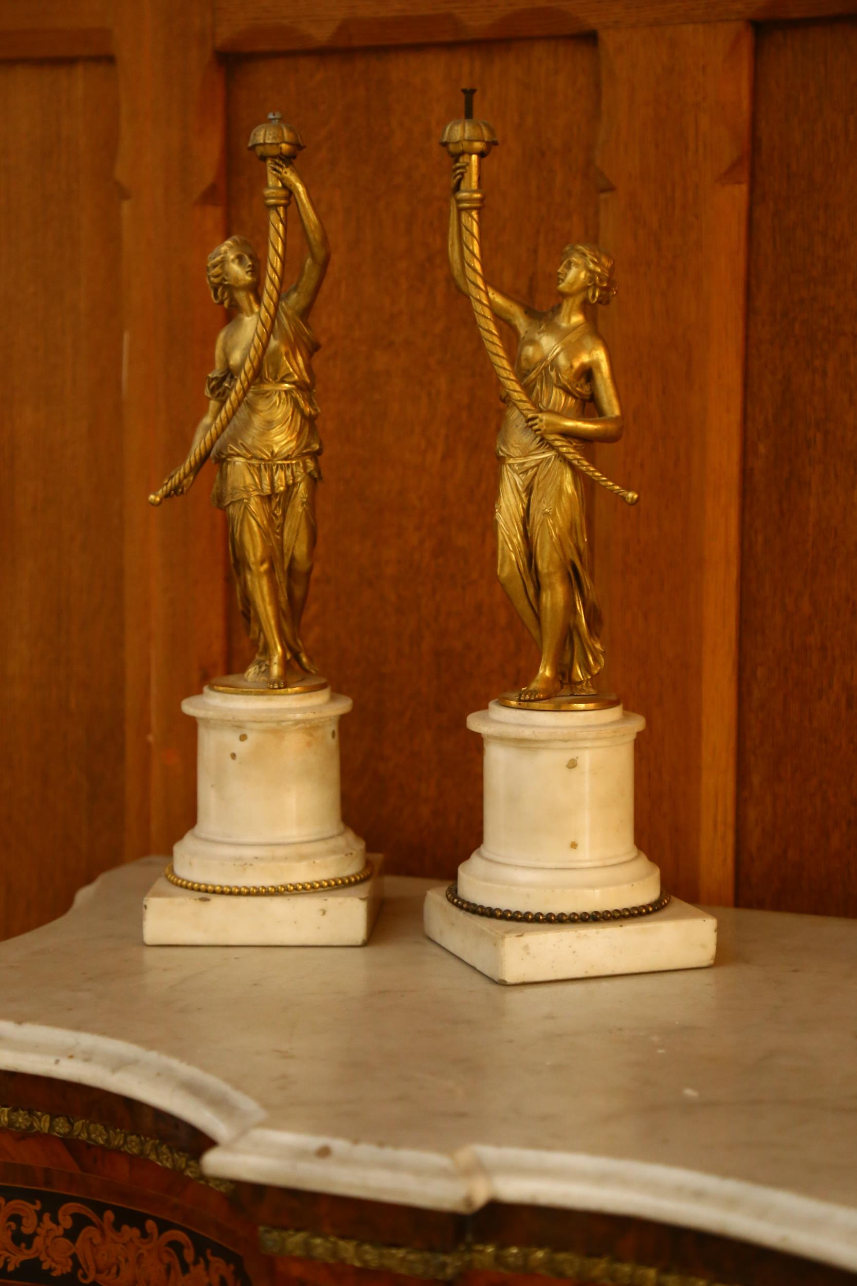 A pair of 19th century Renaissance style gilt-bronze figural table centres, modelled as Classical