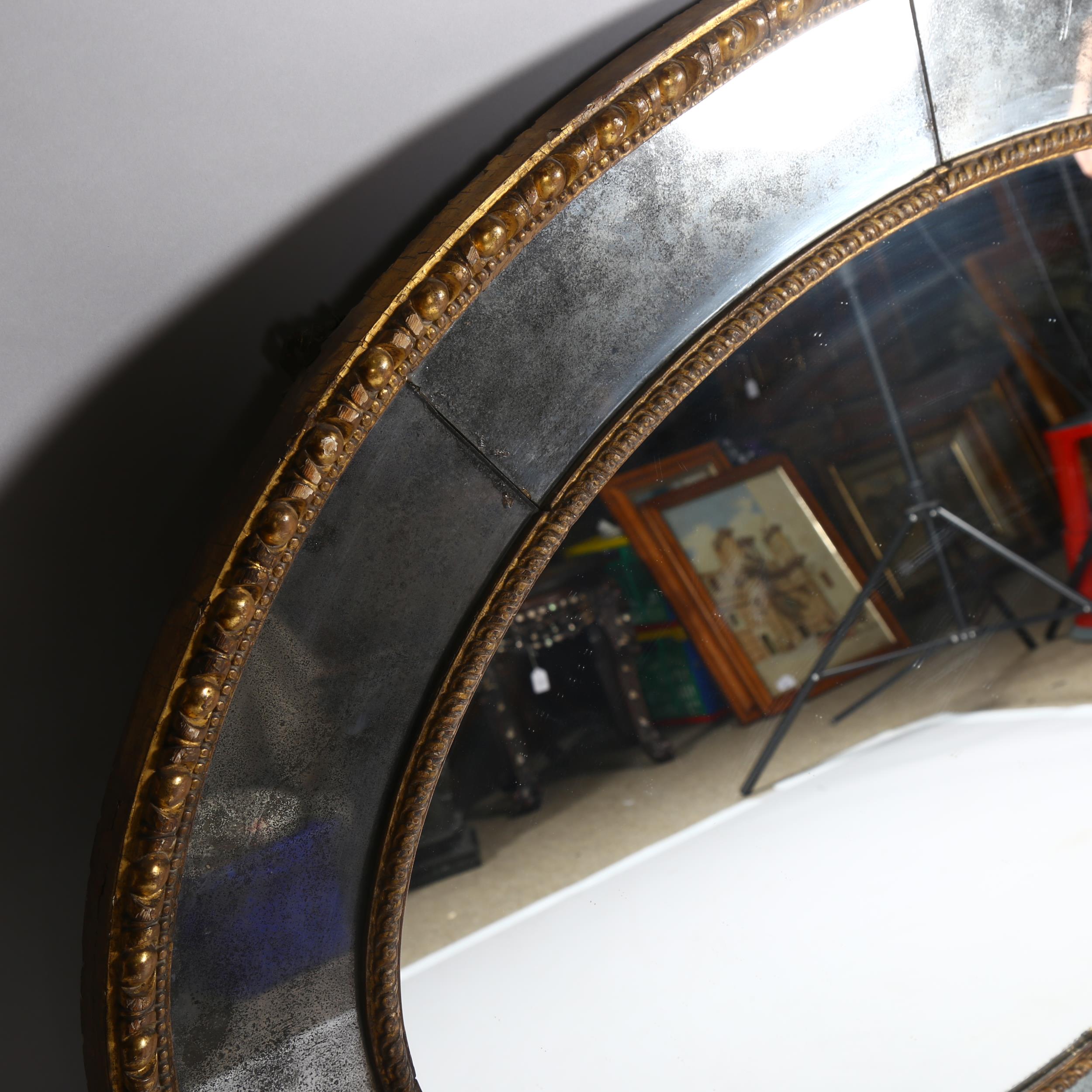 A large oval gilt-framed wall mirror, with inset oxidised mirrored surround, overall measurements - Image 5 of 8