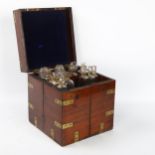 A 19th century brass-bound mahogany travelling apothecary cabinet, with hinged lid and doors opening