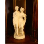 A large 19th century Parian Ware ivory porcelain figure group, modelled as Bacchus and Ariadne,