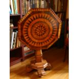 A 19th century Italian parquetry specimen wood tilt-top octagonal wine table, with star and sun